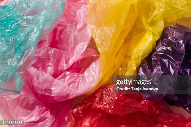 colorful plastic bags pattern. concept problem environmental pollution plastic - polythene stock pictures, royalty-free photos & images