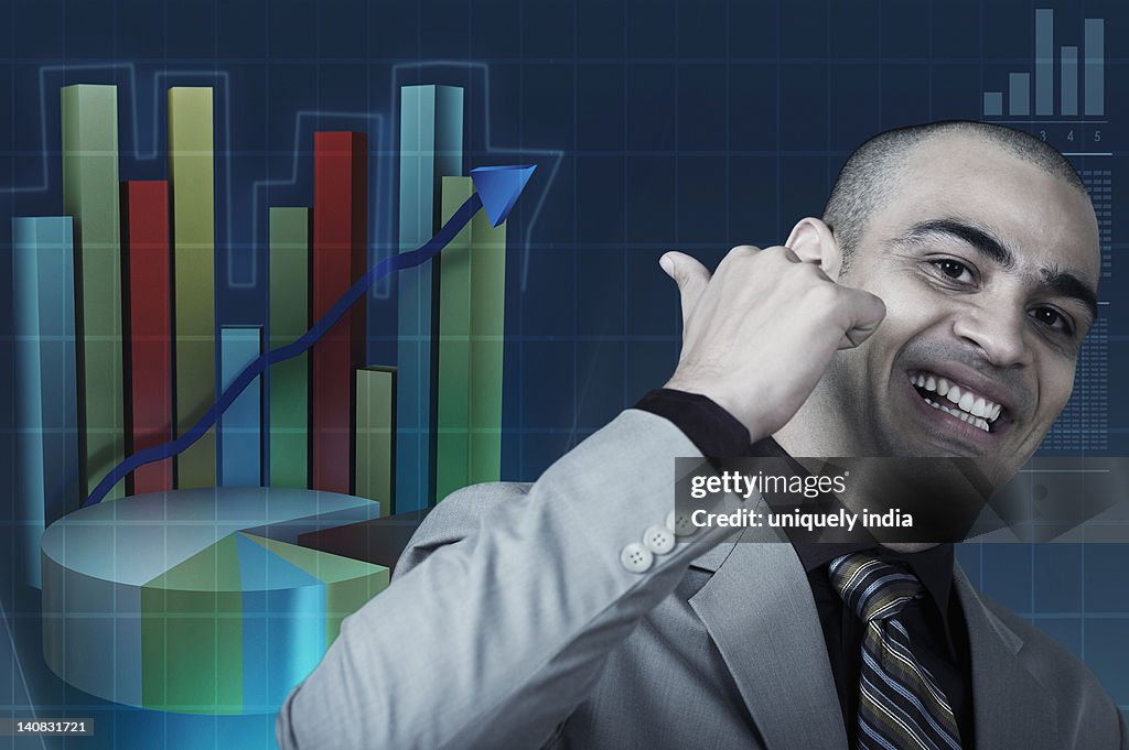 Businessman pointing at a graph