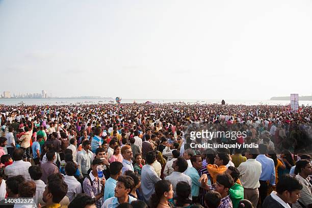 crowd at religious procession during ganpati visarjan ceremony, mumbai, maharashtra, india - ganesh chaturthi fotografías e imágenes de stock