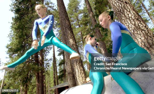 At left, Hailey Winnen, of King's Mountain Club from Half Moon Bay, leaped off a pommel horse while practicing her routine. The American Vaulting...