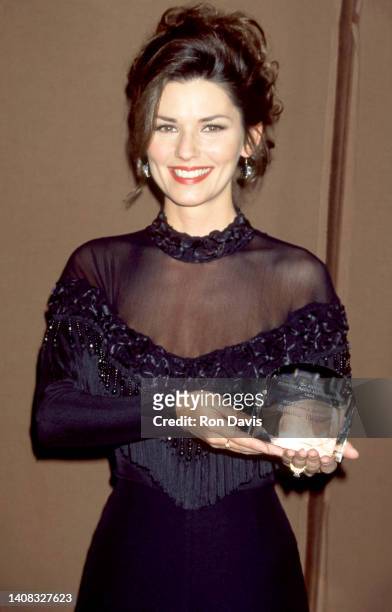 Canadian singer and songwriter Shania Twain, poses with her CMA Awards during The 1995 29th Country Music Association Awards on October 4, 1995 at...