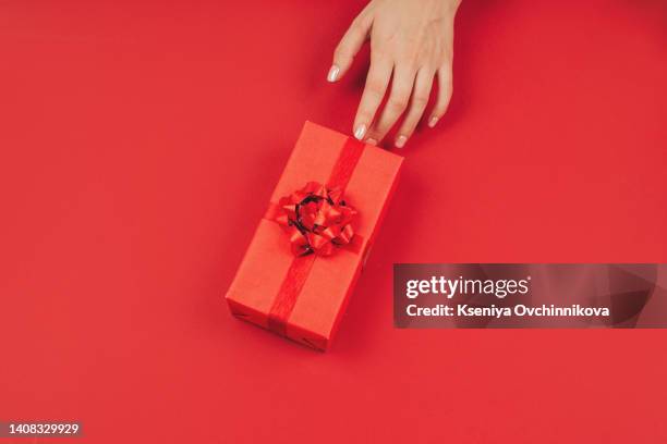 woman holding small red present box in hands. - minute dating stock pictures, royalty-free photos & images