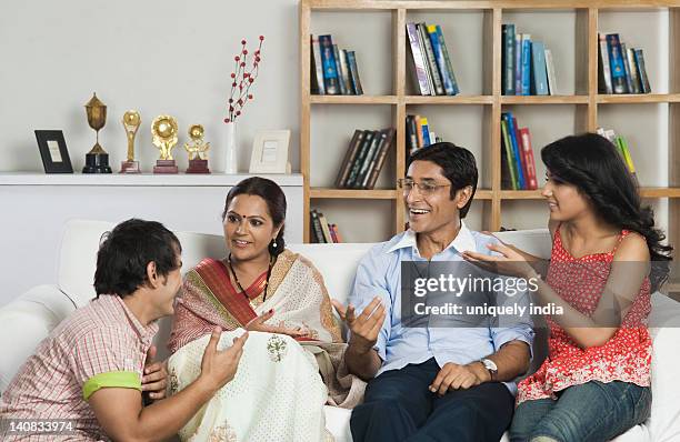 man talking to his family - trophy shelf stock pictures, royalty-free photos & images