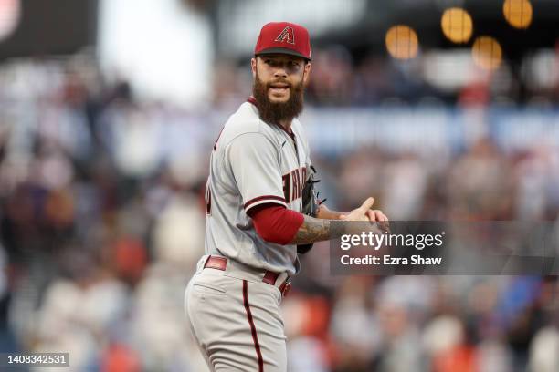 Dallas Keuchel of the Arizona Diamondbacks reacts after giving up a home run to Thairo Estrada of the San Francisco Giants in the third inning at...