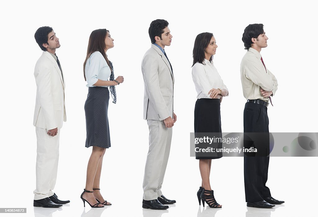 Business executives waiting in a line