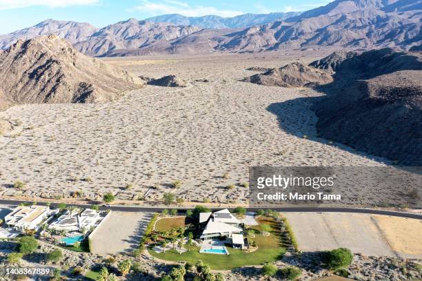 An aerial view of homes next to undeveloped desert on July 12, 2022 in La Quinta, California. According to the U.S. Drought Monitor, more than 97...