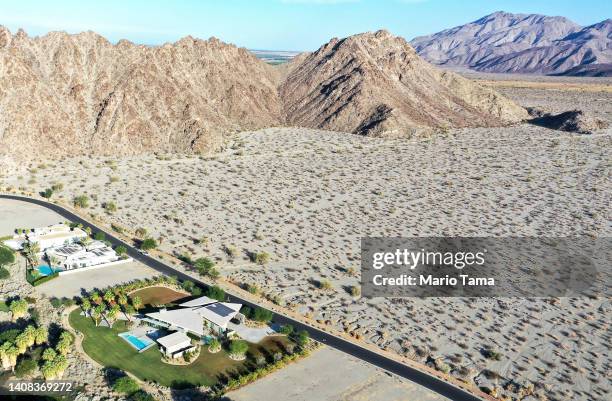 An aerial view of homes next to undeveloped desert on July 12, 2022 in La Quinta, California. According to the U.S. Drought Monitor, more than 97...