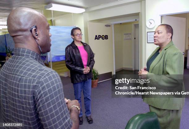 Ebaids002_pc.jpg At right, executive director Hazel Wesson chats with case managers George Gray and Lizabeth Bates both former clients who are now...