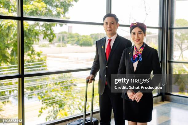 cabin crew walking together to work. - pilot cabin crew stock pictures, royalty-free photos & images