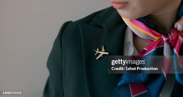 cabin crew getting ready for her work. - flight attendant stock pictures, royalty-free photos & images