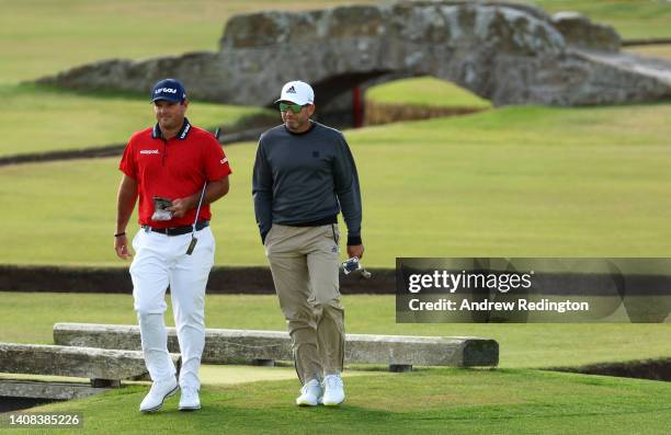 Patrick Reed of The United States and Sergio Garcia of Spain interact on the 1st during a practice round prior to The 150th Open at St Andrews Old...