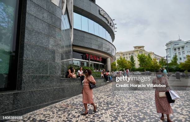 Shoppers walk past "El Corte Inglés" department store as temperature rises to 36º Celsius on July 12, 2022 in Lisbon, Portugal. High temperatures...