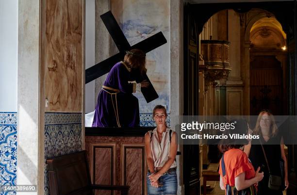 Tourists visit Nossa Senhora da Encarna�ção church as temperature rises to 36º Celsius on July 12, 2022 in Lisbon, Portugal. High temperatures favor...