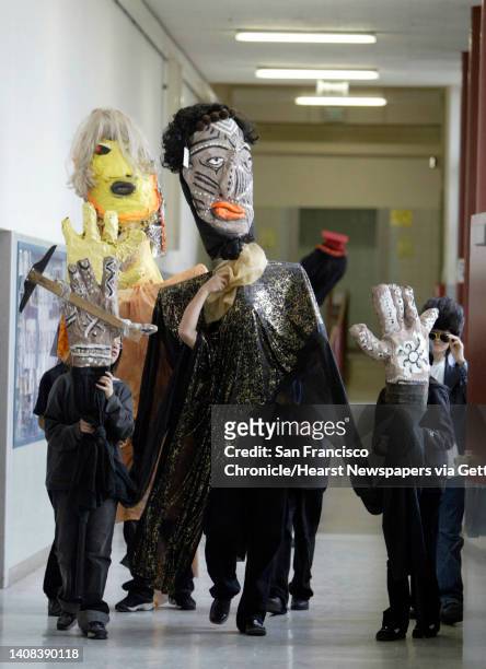 Wbschools25_014_pc.jpg Large puppets taking part in the festivities walk to the auditorium. A.P. Giannini Middle School celebrated its 50th...