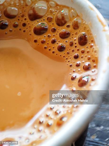 macro of tea cup - cafeïne stockfoto's en -beelden