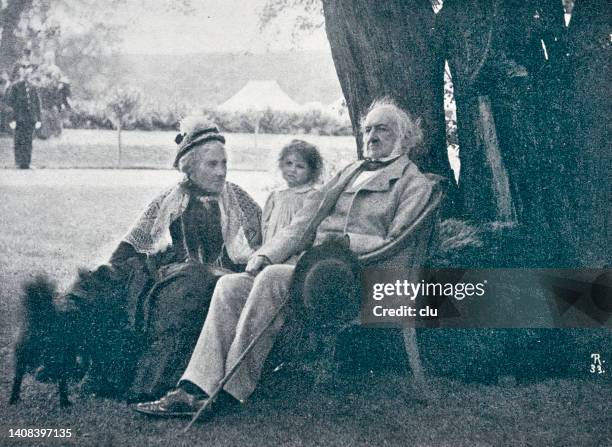 william ewart gladstone, british prime minister, with his family under the old beech - william ewart gladstone stock illustrations