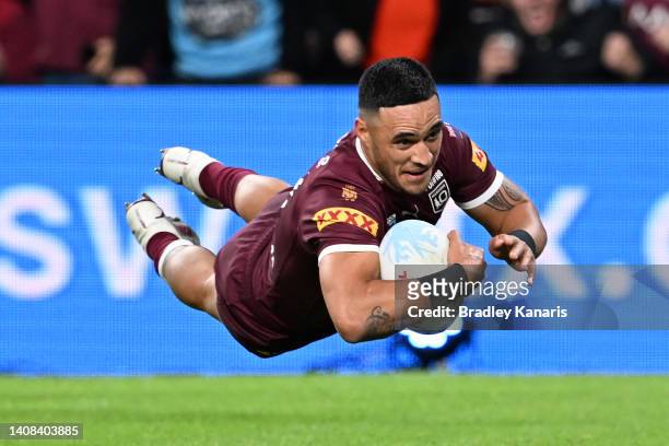 Valentine Holmes of the Maroons scores a try during game three of the State of Origin Series between the Queensland Maroons and the New South Wales...