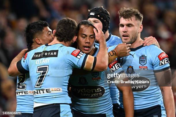 Jarome Luai of the Blues celebrates with teammates after scoring a try during game three of the State of Origin Series between the Queensland Maroons...