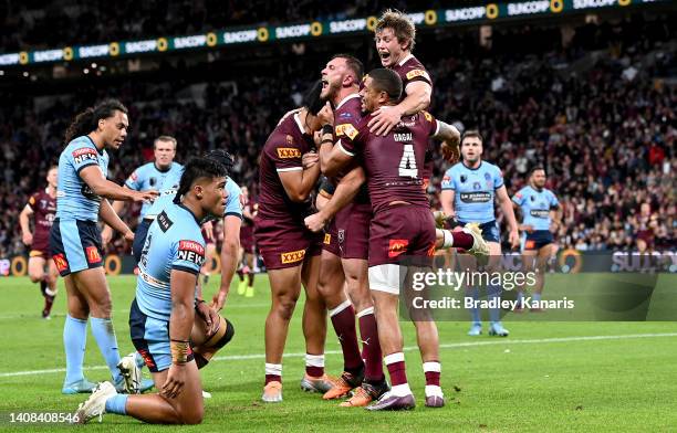 Kurt Capewell of Queensland celebrates scoring a try during game three of the State of Origin Series between the Queensland Maroons and the New South...