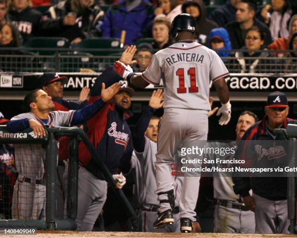 Edgar Renteria is greeted by teammates after his 3rd inning home run. The San Francisco Giants vs. The Atlanta Braves at AT&T Park on 4/7/06 in San...