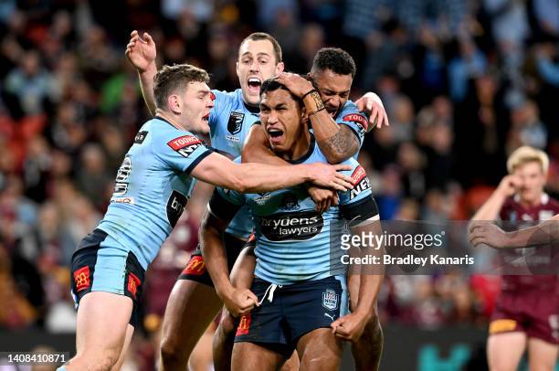 Jacob Saifiti of the Blues celebrates scoring a try during game three of the State of Origin Series between the Queensland Maroons and the New South...