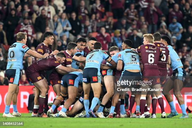 Players scuffle during game three of the State of Origin Series between the Queensland Maroons and the New South Wales Blues at Suncorp Stadium on...
