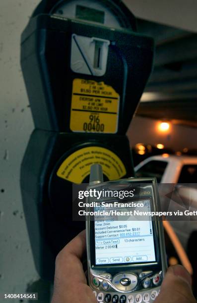 Cosimo Spera, president and CEO of Zipidy parking systems, demonstrates his company's innovation which pays for parking meters using your cellphone...