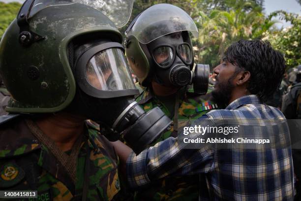 Protestor confronts soldiers during a protest seeking the ouster of Sri Lanka's Prime Minister Ranil Wickremesinghe amidst the ongoing economic...