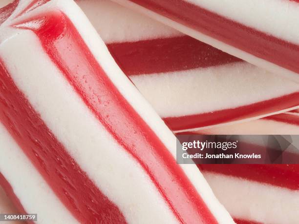 extreme close up red and white striped candy - allsorts stock pictures, royalty-free photos & images