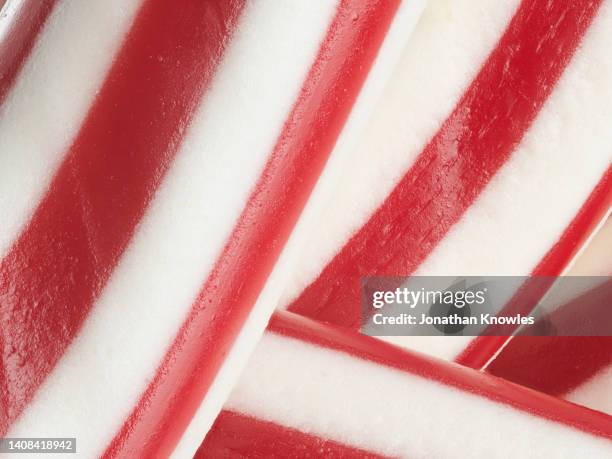 extreme close up red and white striped candy - allsorts stock pictures, royalty-free photos & images
