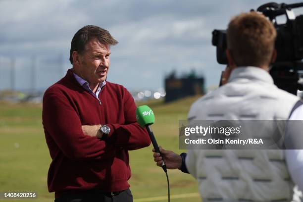 Sir Nick Faldo of England is interviewed on the practice range during a practice round prior to The 150th Open at St Andrews Old Course on July 13,...