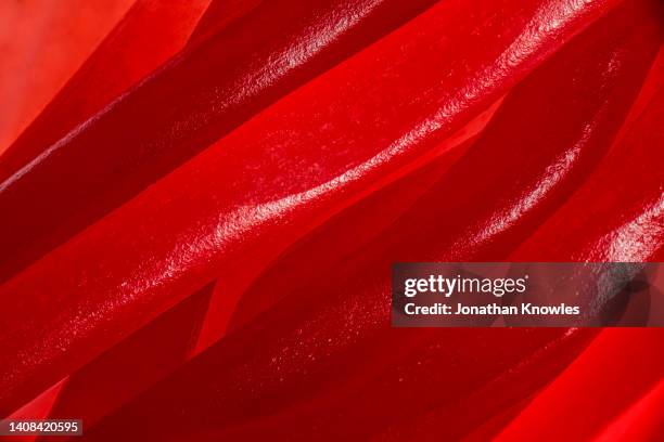 extreme close up red strawberry licorice - food texture stock pictures, royalty-free photos & images