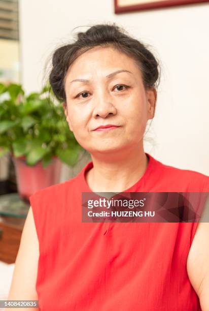portrait of serious middle-aged asian woman - east asian ethnicity stock pictures, royalty-free photos & images