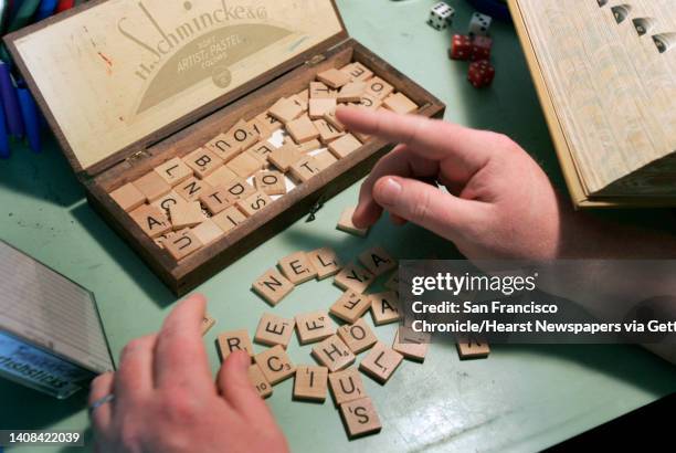 Mark Gunnion frequently uses Scrabble tiles to form new words. Gunnion worked in the basement studio of his home in San Francisco, Calif. On Friday,...