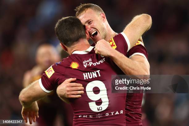 Daly Cherry-Evans of the Maroons celebrates with Ben Hunt of the Maroons after winning game three of the State of Origin Series between the...