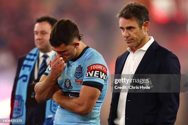 Nathan Cleary of the Blues and Blues coach Brad Fittler look on after game three of the State of Origin Series between the Queensland Maroons and the...