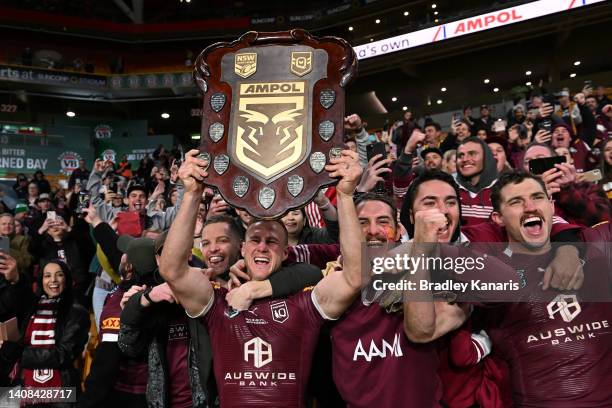 Daly Cherry-Evans and Corey Oates of the Maroons celebrate victory with the crowd after winning game three of the State of Origin Series between the...