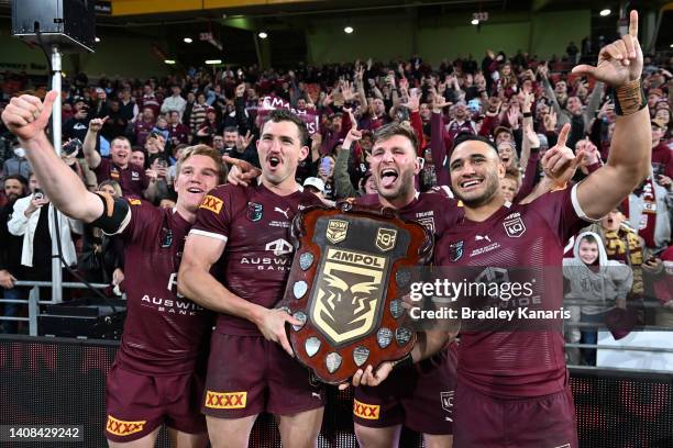 Tom Dearden, Corey Oates, Jai Arrow and Valentine Holmes of the Maroons celebrate victory during game three of the State of Origin Series between the...