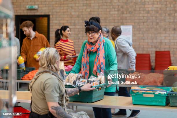 food drive at a church - human arm stockfoto's en -beelden