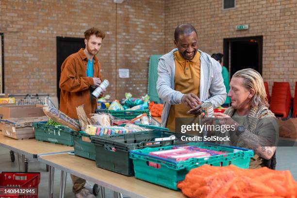 generosity from the community - foodbanks for the needy stock pictures, royalty-free photos & images