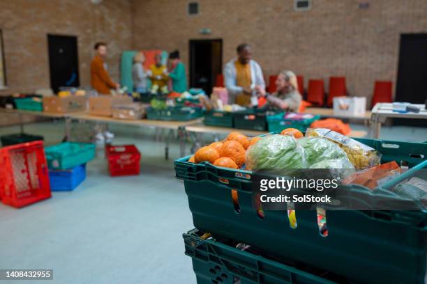 donations at a food bank charity - food donation stock pictures, royalty-free photos & images