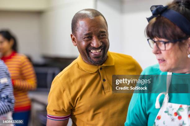 volunteers working together - foodbanks for the needy stock pictures, royalty-free photos & images