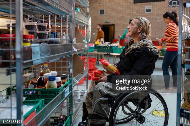 taking care of the community - foodbanks for the needy stock pictures, royalty-free photos & images
