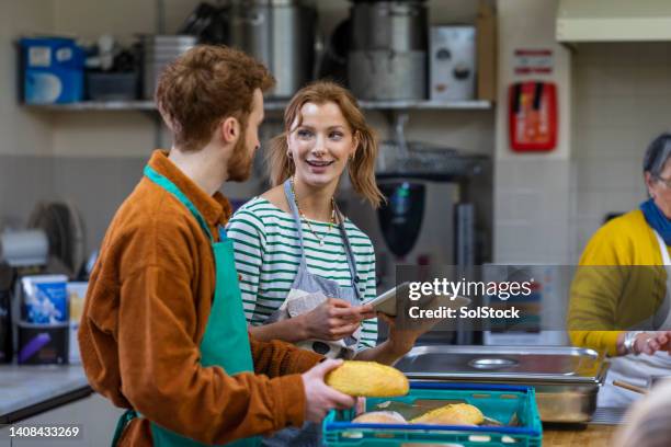 running an essential service - food banks uk stock pictures, royalty-free photos & images