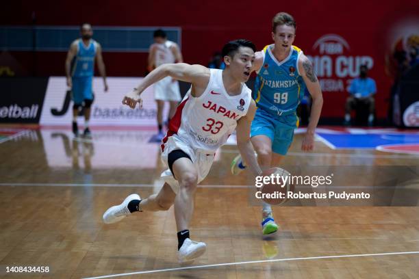 Yuki Kawamura of Japan dribbles the ball during the FIBA Asia Cup Group C game between Japan and Kazakhstan at Istora Gelora Bung Karno on July 13,...