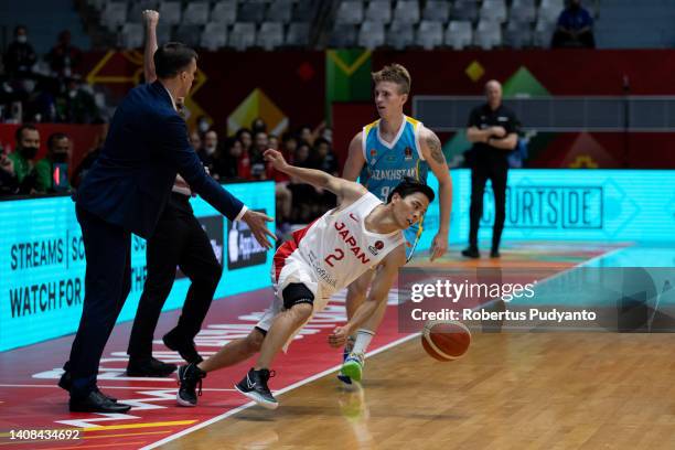 Yuki Togashi of Japan fights for the ball against Oleh Balashov of Kazakhstan during the FIBA Asia Cup Group C game between Japan and Kazakhstan at...