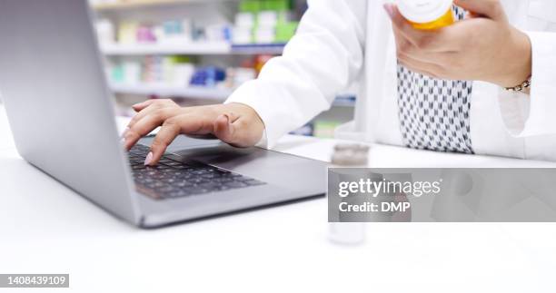 hands of chemist in a pharmacy checking medicine on a laptop at a dispensary. closeup of a pharmacist filling a prescription, or checking information online for medication inside a drugstore - list stock pictures, royalty-free photos & images