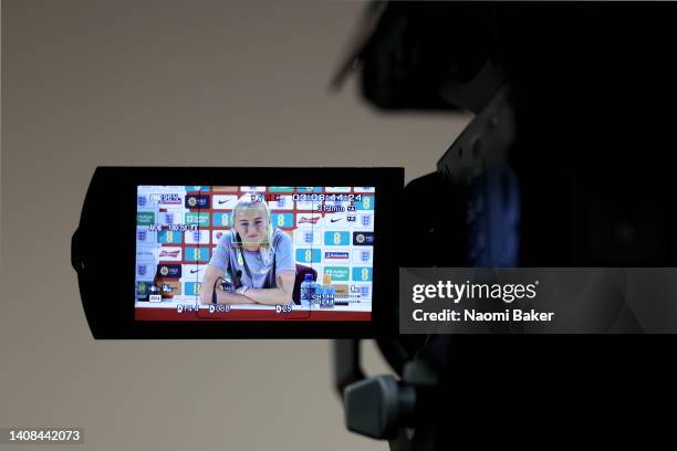 Camera films Chloe Kelly of England as they speak to the media during an England Press Conference at The Lensbury on July 13, 2022 in Teddington,...