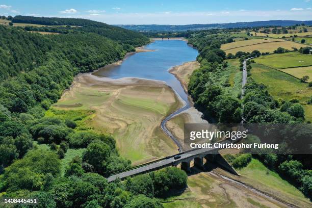 An aerial view of the drying out bed and receded water levels at Lindley Wood Reservoir on July 13, 2022 in Otley, England. A spokesman for Yorkshire...