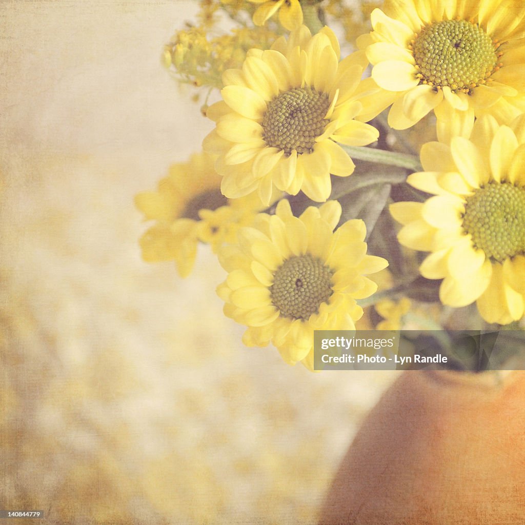 Vase full of yellow flowers